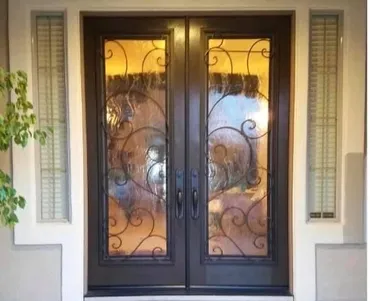 A double door with two wrought iron doors.