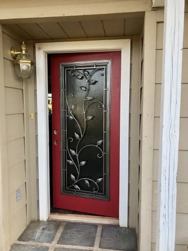 A red door with a white frame