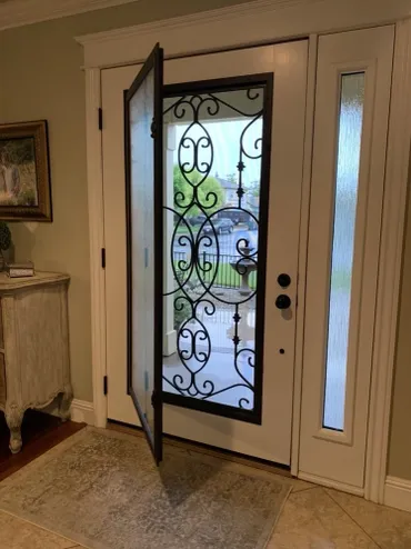 A door with a glass panel and metal frame.