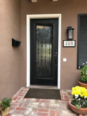 A black door with a number on it