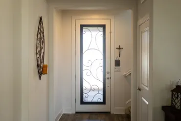 A white door beyong the hallway