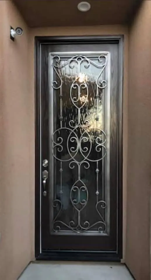 A dark brown door with silver highlights