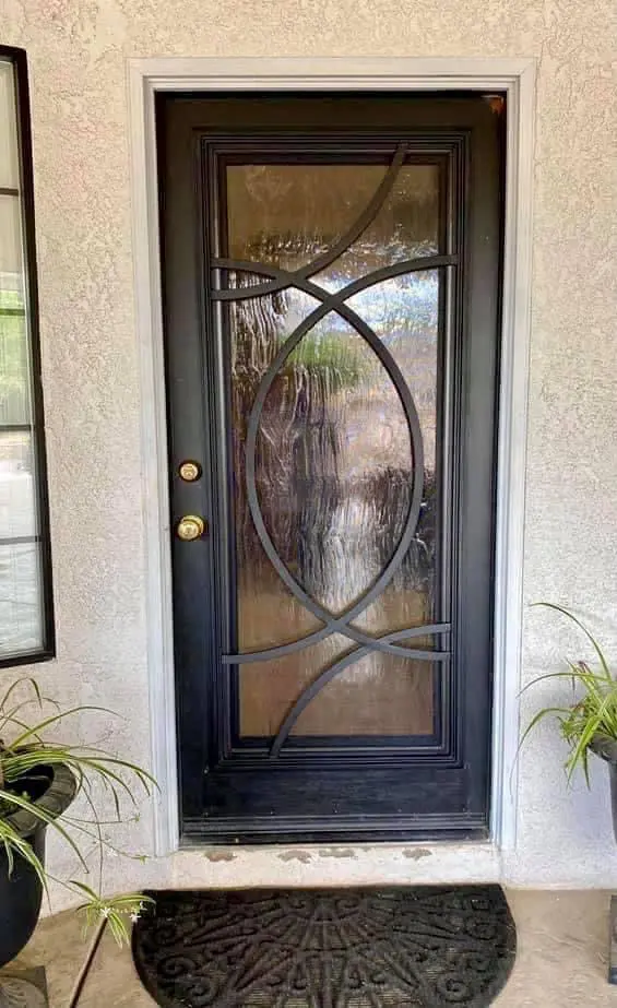 A door with a glass window and metal frame.