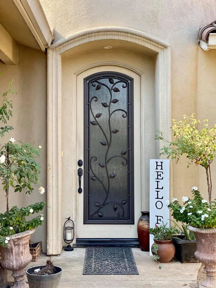 A front door with a sign that says hello
