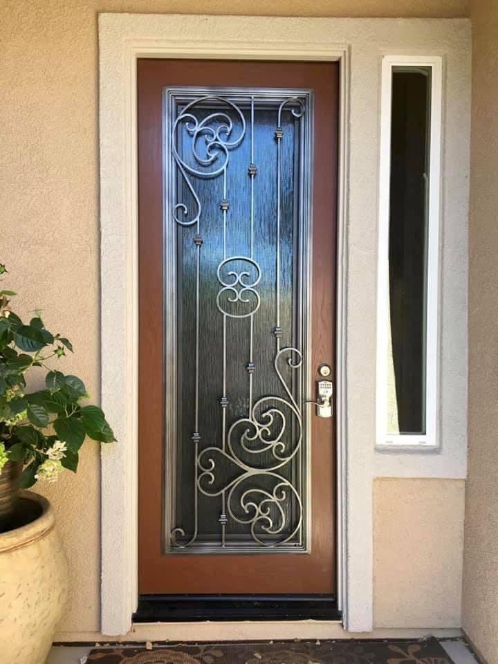 A door with glass and metal designs