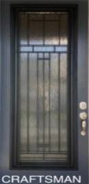 A door with a metal grill and glass.