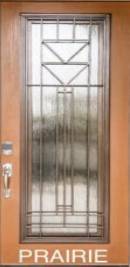 A door with a glass window and metal bars.