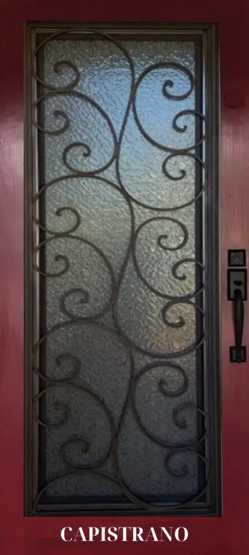 Ornate iron door with glass panels.